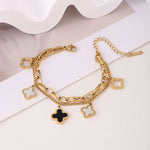 Load image into Gallery viewer, Black &amp; White Clover Charm Bracelet
